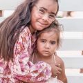 Reviewer photo: two young girls hugging