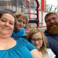 Reviewer photo: selfie of a woman, a bearded man and two children
